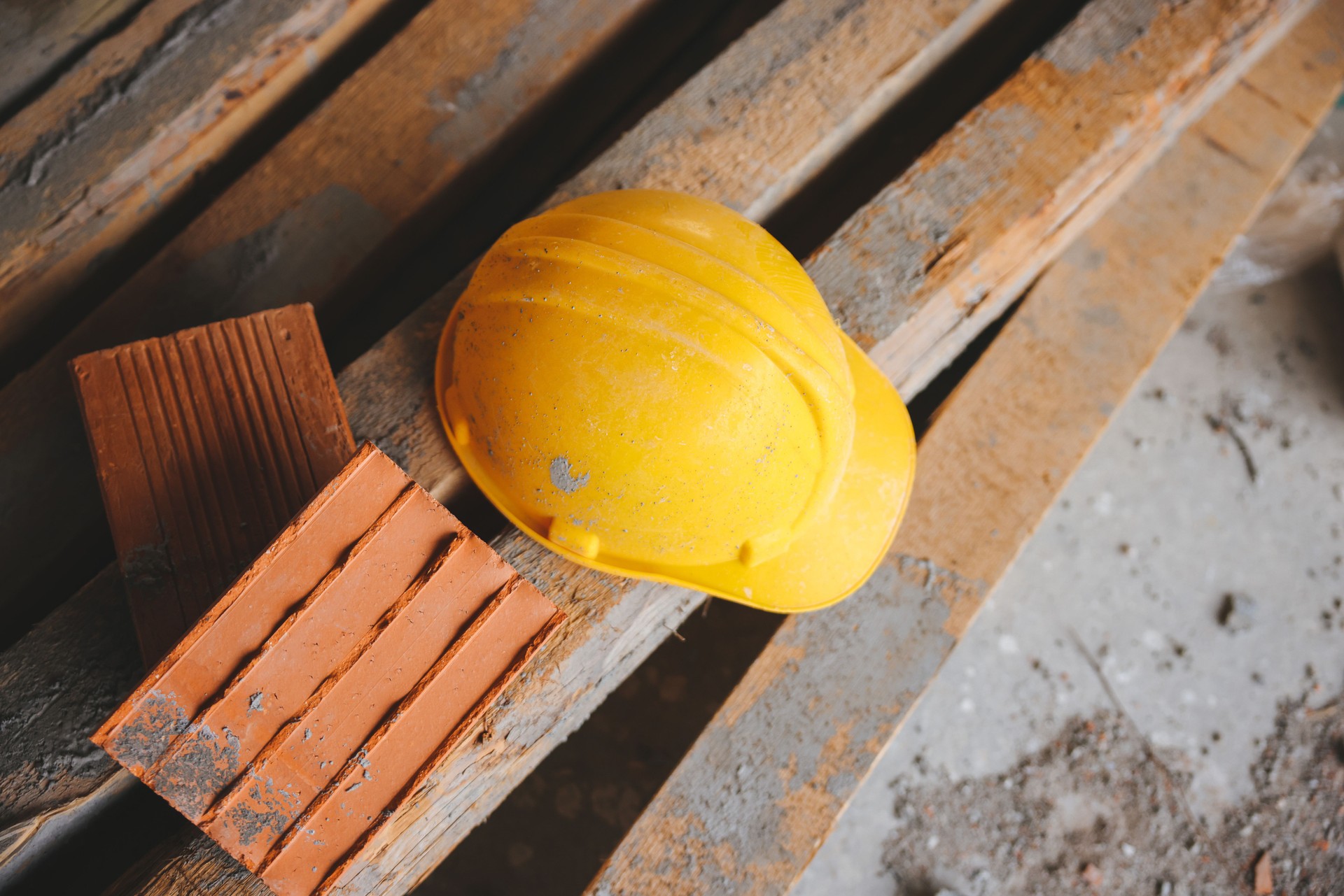 Engineer and construction ideas concept with yellow helmet equipment tools at construction site